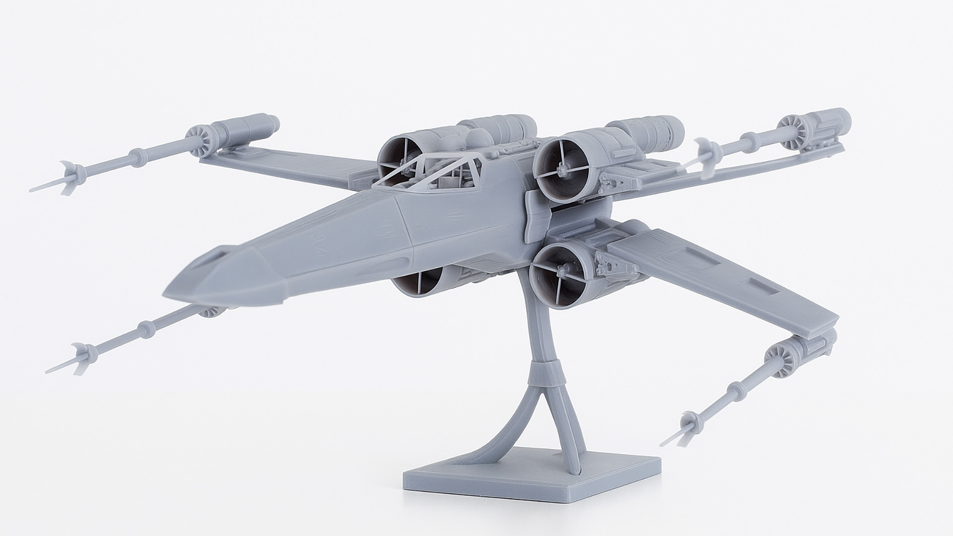 Sz&uuml;rke X-Wing modell r&eacute;szletes hajt&oacute;művekkel &eacute;s bemutat&oacute;&aacute;llv&aacute;nnyal